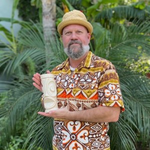 Odd Rodney Holds Up Mug Collaboration With Trader Vic's