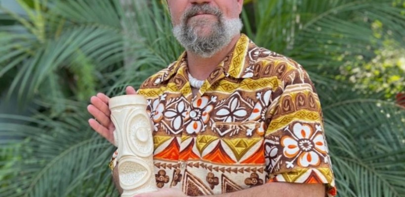 Odd Rodney Holds Up Mug Collaboration With Trader Vic's